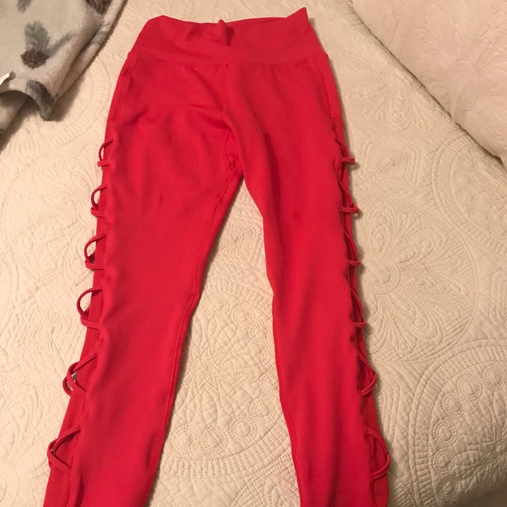 BuffBunny cross my heart red leggings. Size small